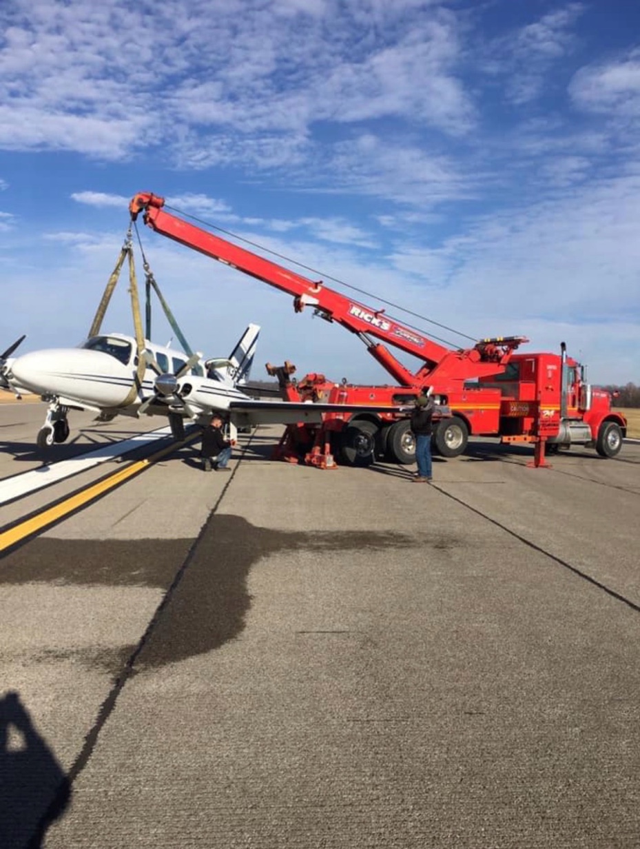 Rick's Towing aircraft recovery on airport runway — specialty towing