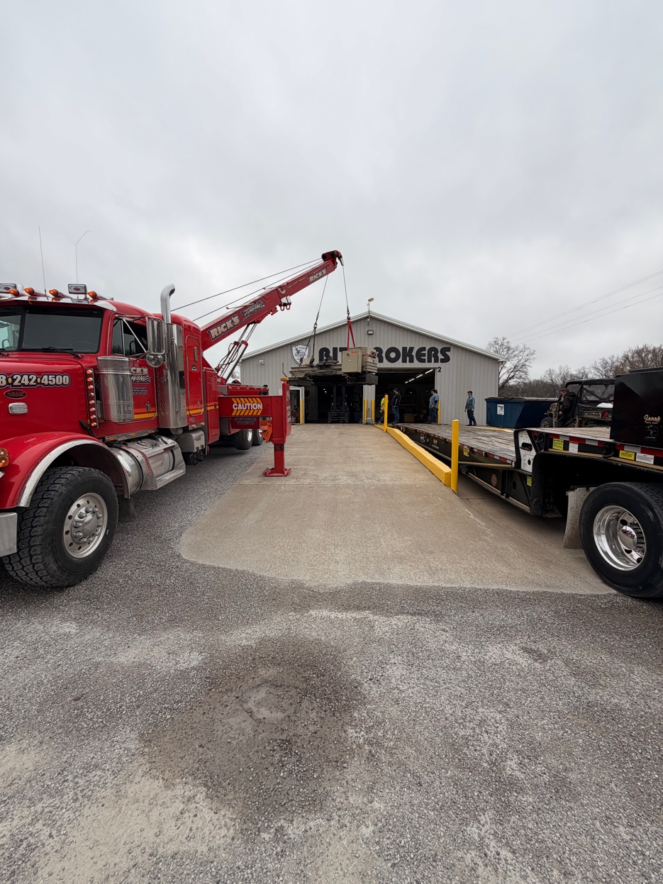 Rick's Towing rotator crane lifting and placing industrial equipment