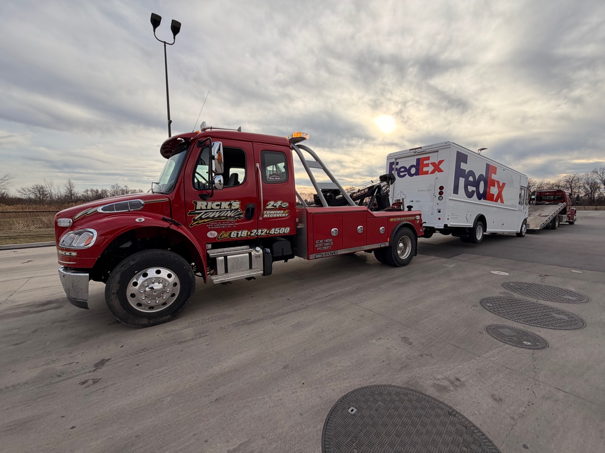 Rick's Towing towing FedEx commercial van — medium duty