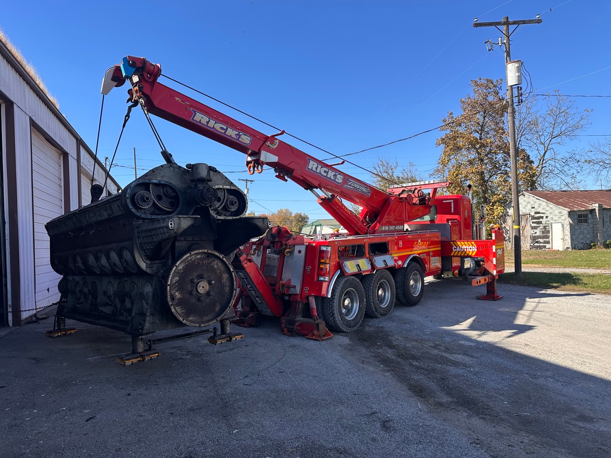 Rick's Towing rotator crane lifting diesel engine — heavy recovery
